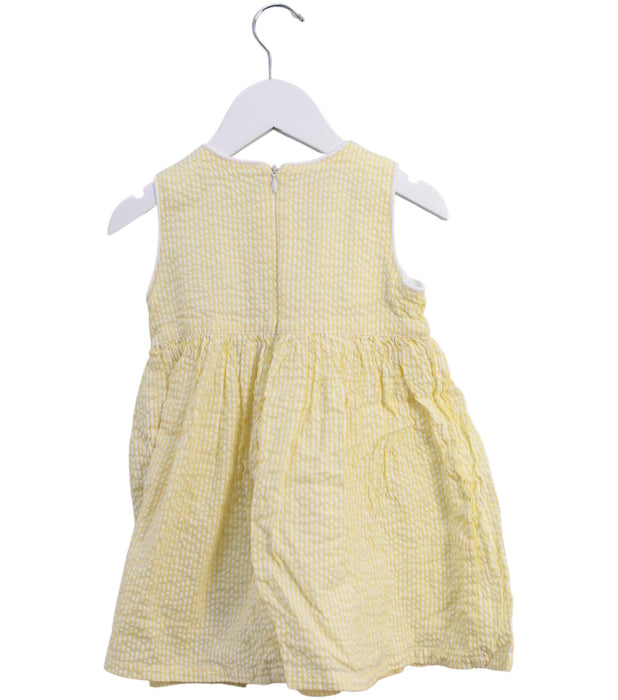 A Yellow Sleeveless Dresses from Pan Con Chocolate in size 3T for girl. (Back View)