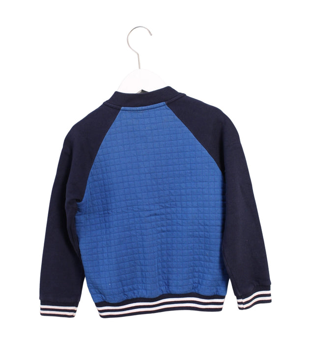 A Blue Lightweight Jackets from Petit Bateau in size 6T for boy. (Back View)