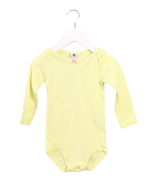 A Yellow Long Sleeve Bodysuits from Petit Bateau in size 18-24M for girl. (Front View)