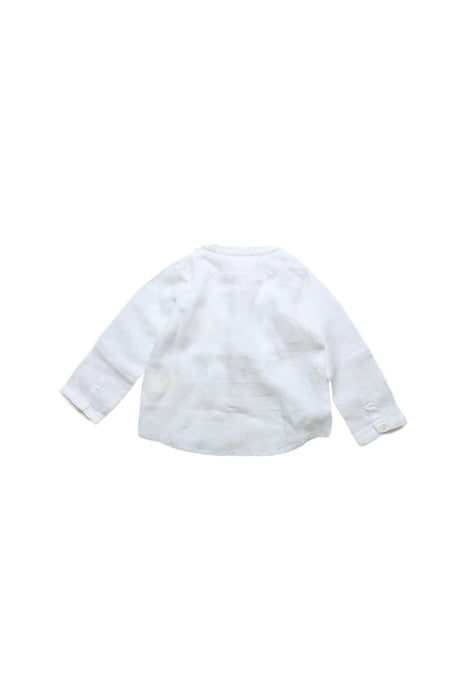 A White Long Sleeve Shirts from Nanos in size 12-18M for boy. (Back View)