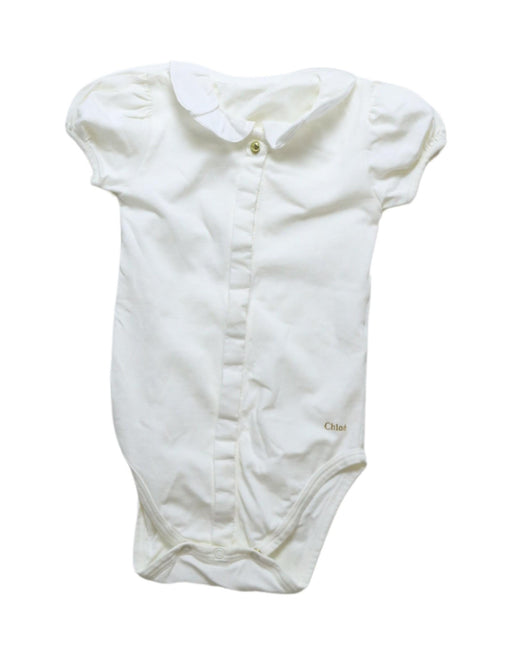 A White Short Sleeve Bodysuits from Chloe in size 6-12M for girl. (Front View)
