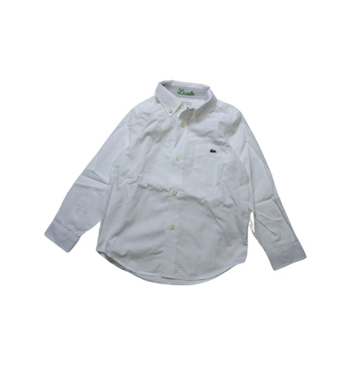 A White Long Sleeve Shirts from Lacoste in size 4T for boy. (Front View)