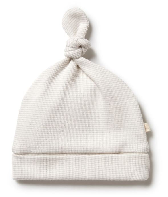 A Ivory Beanies from Wilson & Frenchy in size Newborn for neutral. (Front View)