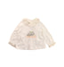 A Ivory Long Sleeve Tops from Nanos in size 12-18M for girl. (Front View)