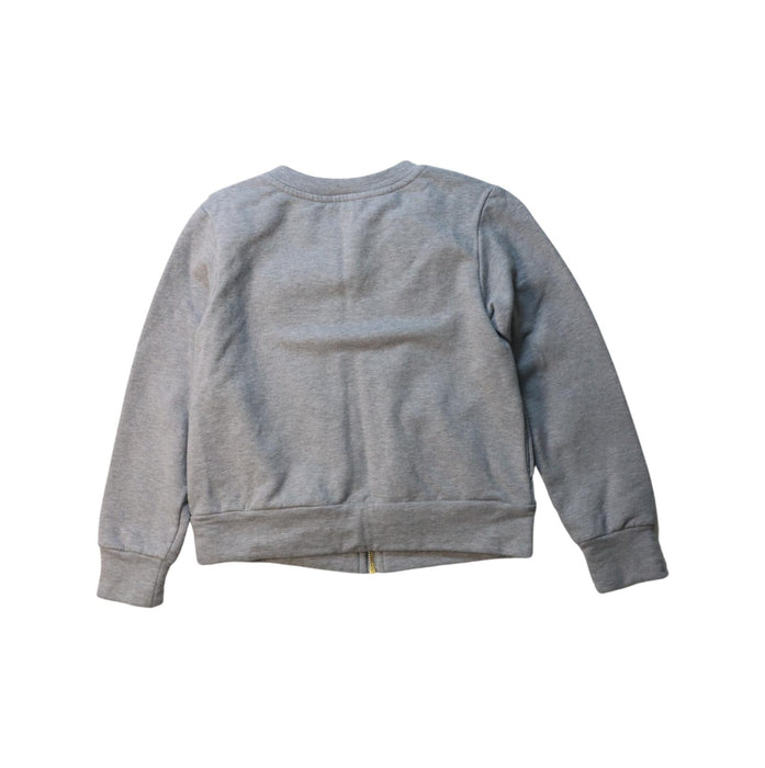 A Grey Zippered Sweatshirts from Jacadi in size 6T for girl. (Back View)