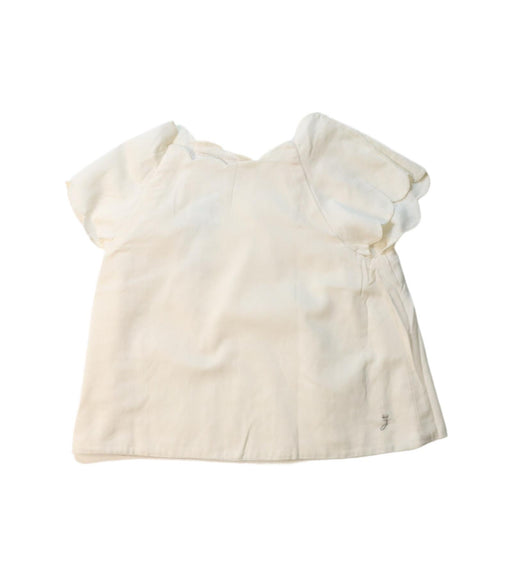A Ivory Short Sleeve Tops from Jacadi in size 4T for girl. (Front View)