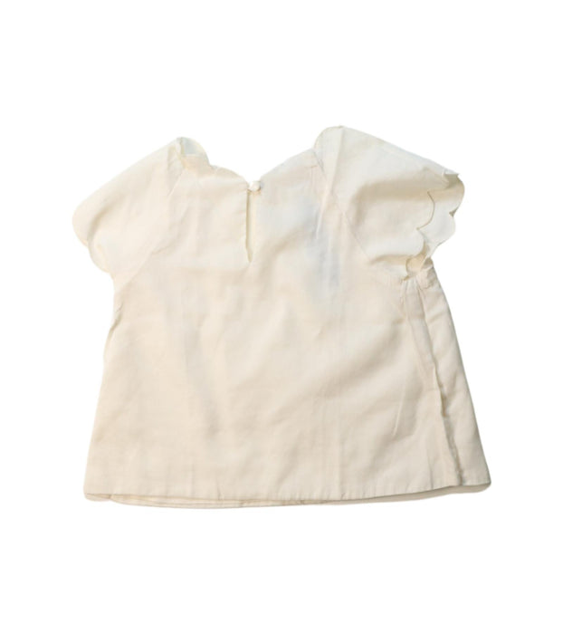 A Ivory Short Sleeve Tops from Jacadi in size 4T for girl. (Back View)