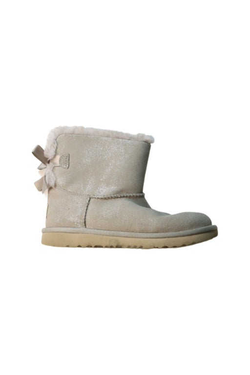 A Brown Winter Boots from UGG in size 7Y for girl. (Front View)
