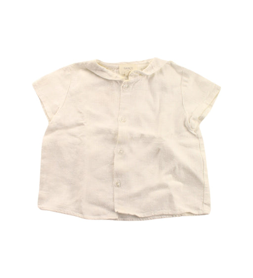 A White Short Sleeve Shirts from Nanos in size 12-18M for girl. (Front View)