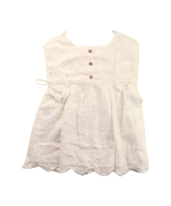 A White Sleeveless Dresses from Louise Misha in size 3T for girl. (Back View)