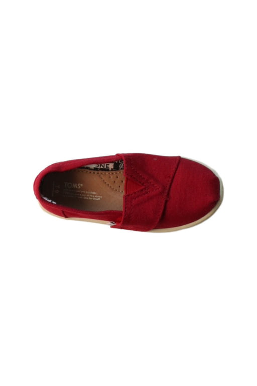 A Red Slip Ons from Toms in size 4T for girl. (Front View)