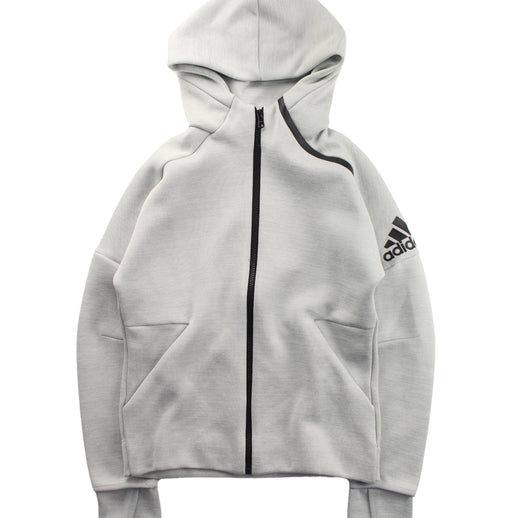 A White Zippered Sweatshirts from Adidas in size 10Y for boy. (Front View)