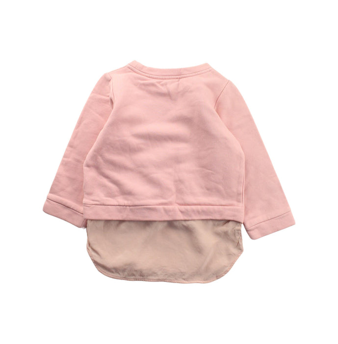 A Pink Crewneck Sweatshirts from COS in size 2T for girl. (Back View)