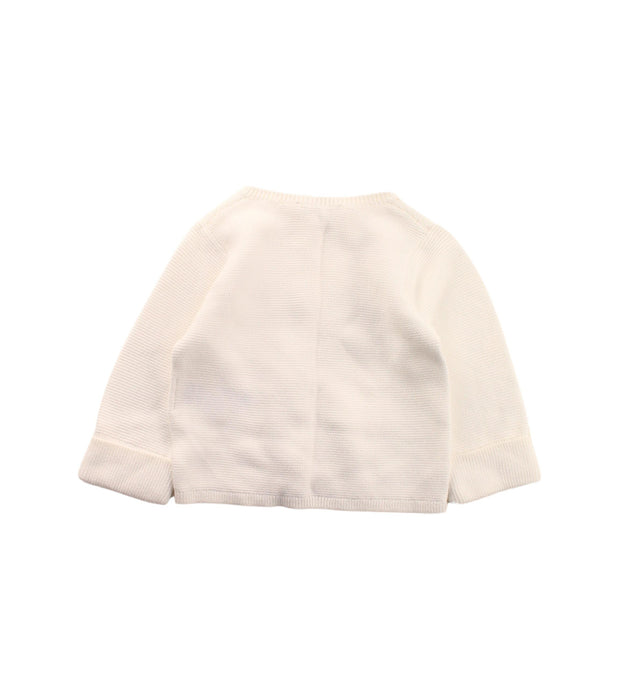 A White Cardigans from Jacadi in size 3-6M for girl. (Back View)