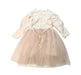 A Ivory Long Sleeve Dresses from Aosta in size 3T for girl. (Back View)