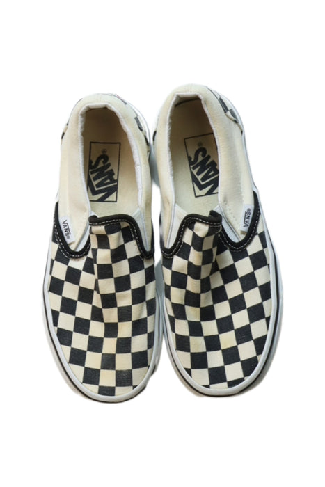 A Black Slip Ons from Vans in size 10Y for boy. (Back View)