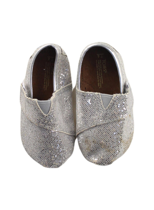A Silver Slip Ons from Toms in size 12-18M for girl. (Back View)