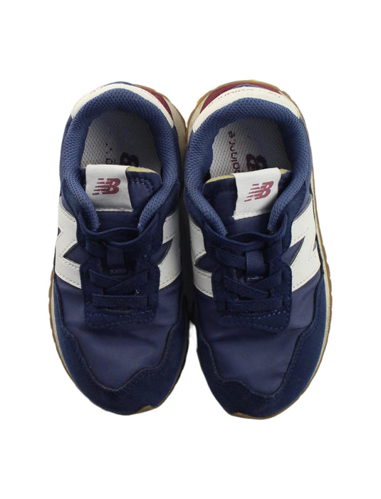 A Blue Sneakers from New Balance in size 5T for boy. (Back View)