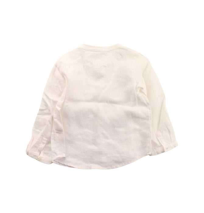 A White Long Sleeve Shirts from Nanos in size 12-18M for boy. (Back View)