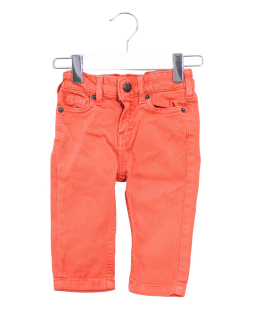 A Orange Jeans from CdeC in size 3-6M for boy. (Front View)