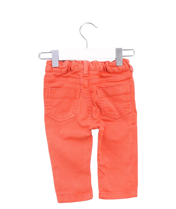 A Orange Jeans from CdeC in size 3-6M for boy. (Back View)