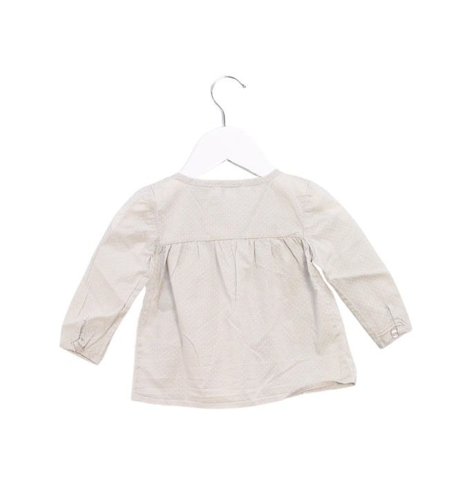 A Grey Long Sleeve Tops from CdeC in size 3-6M for girl. (Back View)