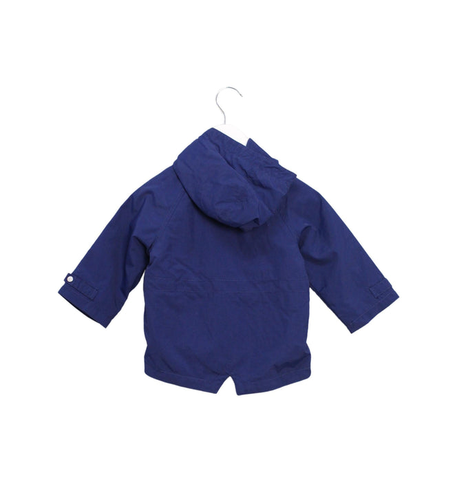 A Navy Rain Jackets from Minibanda in size 6-12M for boy. (Back View)
