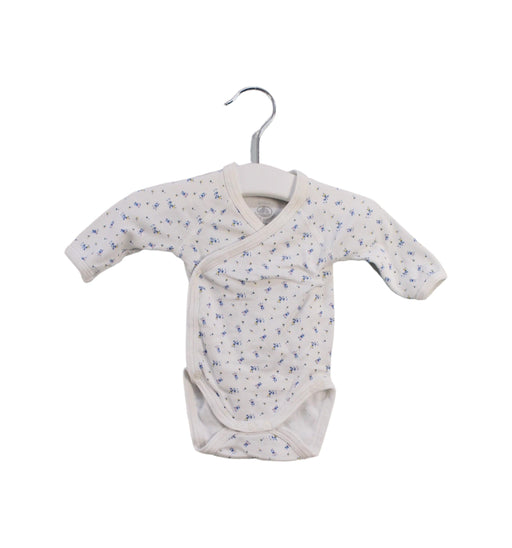 A White Bodysuits from Petit Bateau in size Newborn for girl. (Front View)
