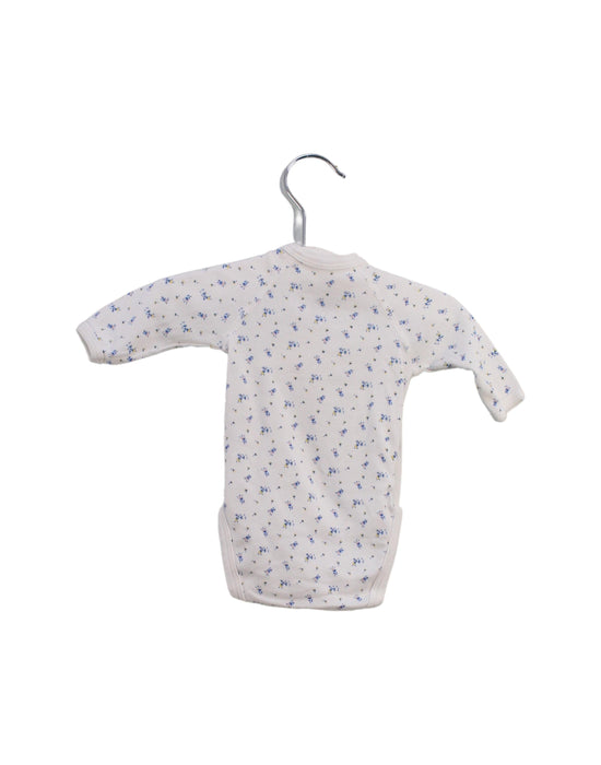 A White Bodysuits from Petit Bateau in size Newborn for girl. (Back View)