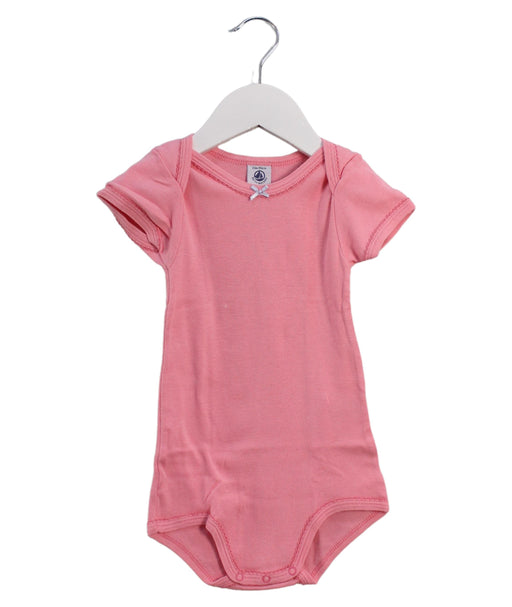 A Pink Short Sleeve Bodysuits from Petit Bateau in size 18-24M for girl. (Front View)